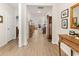 Bright hallway with hardwood floors and views to living and dining area at 1262 Witch Hazel Way, Longs, SC 29568
