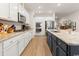 Well-equipped kitchen with granite countertops and white cabinets at 1262 Witch Hazel Way, Longs, SC 29568