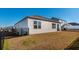 View of the home's backyard with a metal fence, showing the house's siding and windows at 127 Marauder Dr., Longs, SC 29568