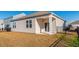 Tan house exterior with covered patio and fence at 127 Marauder Dr., Longs, SC 29568