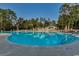 Community pool area with lounge chairs and a pool house at 1401 Lighthouse Dr. # 4312, North Myrtle Beach, SC 29582