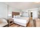 Bright bedroom featuring a king bed, stylish decor, and hardwood floors at 1501 S Ocean Blvd. # 1442, Myrtle Beach, SC 29577