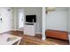 Cozy living room featuring a TV and a comfortable brown leather bench at 1501 S Ocean Blvd. # 1442, Myrtle Beach, SC 29577
