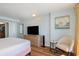 Well-appointed main bedroom with a sleek dresser and a peek into the kitchen area at 1501 S Ocean Blvd. # 1442, Myrtle Beach, SC 29577