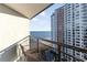 A balcony featuring chairs, a railing and an oceanfront view with an adjacent building at 1501 S Ocean Blvd. # 1549, Myrtle Beach, SC 29577