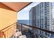 A balcony featuring chairs, a railing and an oceanfront view with an adjacent building at 1501 S Ocean Blvd. # 1549, Myrtle Beach, SC 29577