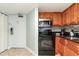Cozy kitchen features stainless steel microwave, and a black oven stove at 1501 S Ocean Blvd. # 1549, Myrtle Beach, SC 29577
