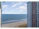 An ocean view from a Landmark Resort upper floor featuring an adjacent building at 1501 S Ocean Blvd. # 1549, Myrtle Beach, SC 29577