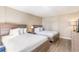 Bright bedroom featuring two beds, soft linens, and neutral walls for a calming retreat at 1501 S Ocean Blvd. # 251, Myrtle Beach, SC 29577