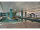 Enjoy this exquisite indoor pool area, featuring a unique design and lush greenery for added ambiance at 1501 S Ocean Blvd. # 251, Myrtle Beach, SC 29577