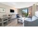 Cozy living space with dining area, sleeper sofa, and balcony access at 1501 S Ocean Blvd. # 251, Myrtle Beach, SC 29577