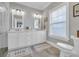 Bathroom features double vanity, white cabinets and a large shower at 22 Trigger Fish Ln., Murrells Inlet, SC 29576