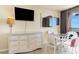 Ocean view condo with white wicker dining set and dresser at 2406 N Ocean Blvd. # 604, Myrtle Beach, SC 29577