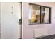 Exterior condo entry door with a window showing the bedroom at 2406 N Ocean Blvd. # 604, Myrtle Beach, SC 29577