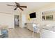 Living room with ocean view, white wicker furniture, and tile floor at 2406 N Ocean Blvd. # 604, Myrtle Beach, SC 29577