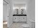 View of the bathroom, showcasing the double sink vanity, tiled floor, and toilet at 33 Captains Pl, Murrells Inlet, SC 29576