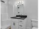 Bathroom featuring a shower-tub, black hardware, and a sleek vanity with a black countertop at 33 Captains Pl, Murrells Inlet, SC 29576