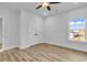 Bedroom with wood floors, closet, overhead fan, and lots of light from the large window at 33 Captains Pl, Murrells Inlet, SC 29576