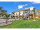 Elevated home with coastal charm, featuring a covered porch and meticulously landscaped yard at 33 Captains Pl, Murrells Inlet, SC 29576