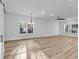 Bright, airy living room boasting wood floors, recessed lights, and abundant sunlight at 33 Captains Pl, Murrells Inlet, SC 29576