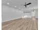 Spacious living room with modern flooring, recessed lighting, and sleek barn doors at 33 Captains Pl, Murrells Inlet, SC 29576