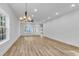Open-concept living area with wood flooring, recessed lighting, and a modern ceiling fan at 33 Captains Pl, Murrells Inlet, SC 29576