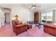 Living room with leather furniture, a wood bookcase, and sliding glass doors at 350 Blue Rock Dr., Longs, SC 29568