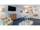 Dining area with round table, chairs, and kitchen bar at 415 Ocean Creek Dr. # 2280, Myrtle Beach, SC 29572