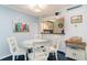 Charming dining area with white table and chairs at 415 Ocean Creek Dr. # 2280, Myrtle Beach, SC 29572