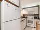 Well-equipped kitchen with white cabinets and appliances at 415 Ocean Creek Dr. # 2280, Myrtle Beach, SC 29572