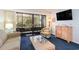 Living room with comfy seating, balcony access, and TV at 415 Ocean Creek Dr. # 2280, Myrtle Beach, SC 29572