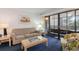 Living room with sofa, armchair, balcony access, and coffee table at 415 Ocean Creek Dr. # 2280, Myrtle Beach, SC 29572