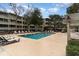 Community pool with plenty of lounge chairs at 415 Ocean Creek Dr. # 2280, Myrtle Beach, SC 29572
