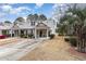 Attractive townhome with gray metal roof, brick accents, and covered porch at 448 Colonial Trace Dr. # 448, Longs, SC 29568