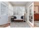 Relaxing sunroom with white wicker furniture and ample natural light at 448 Colonial Trace Dr. # 448, Longs, SC 29568