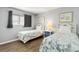 Two twin beds with patterned quilts in a bright bedroom at 4619 S Ocean Blvd. # 207, North Myrtle Beach, SC 29582