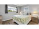 Double bed, light walls, view of ocean, two nightstands at 4619 S Ocean Blvd. # 207, North Myrtle Beach, SC 29582