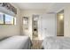 Two twin beds in a well-lit bedroom with ocean view at 4619 S Ocean Blvd. # 207, North Myrtle Beach, SC 29582
