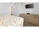 Double bed, dresser, TV on wall, light wood tones at 4619 S Ocean Blvd. # 207, North Myrtle Beach, SC 29582