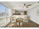 Bright dining area with glass table and wicker chairs, near kitchen at 4619 S Ocean Blvd. # 207, North Myrtle Beach, SC 29582