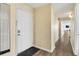 White door, view down hallway, light walls, window at 4619 S Ocean Blvd. # 207, North Myrtle Beach, SC 29582
