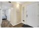 White door, light walls, view of bedroom down hallway at 4619 S Ocean Blvd. # 207, North Myrtle Beach, SC 29582