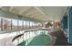 Relaxing indoor pool and hot tub with large windows at 4619 S Ocean Blvd. # 207, North Myrtle Beach, SC 29582