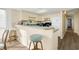 Efficient galley kitchen features a breakfast bar and modern appliances at 4619 S Ocean Blvd. # 207, North Myrtle Beach, SC 29582