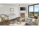 Living room boasts ocean views and comfortable seating at 4619 S Ocean Blvd. # 207, North Myrtle Beach, SC 29582