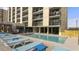 Resort-style pool with ample lounge chairs for sunbathing at 4619 S Ocean Blvd. # 207, North Myrtle Beach, SC 29582