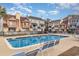 Community pool with lounge chairs, surrounded by townhouses at 501 44Th Ave. N # D-3, Myrtle Beach, SC 29577