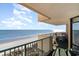 Balcony with table and chairs and stunning ocean view at 501 S Ocean Blvd. # 806, North Myrtle Beach, SC 29582