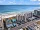 Aerial view of the beachfront property with ocean views and a pool at 507 S Ocean Blvd. # 201, North Myrtle Beach, SC 29582