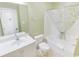 Well-lit bathroom with shower-tub combo, vanity, mirror and modern fixtures at 507 S Ocean Blvd. # 201, North Myrtle Beach, SC 29582